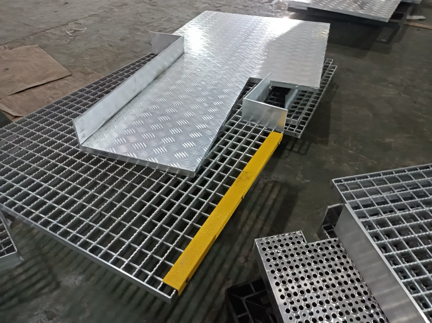Aluminum grating panels on factory floor